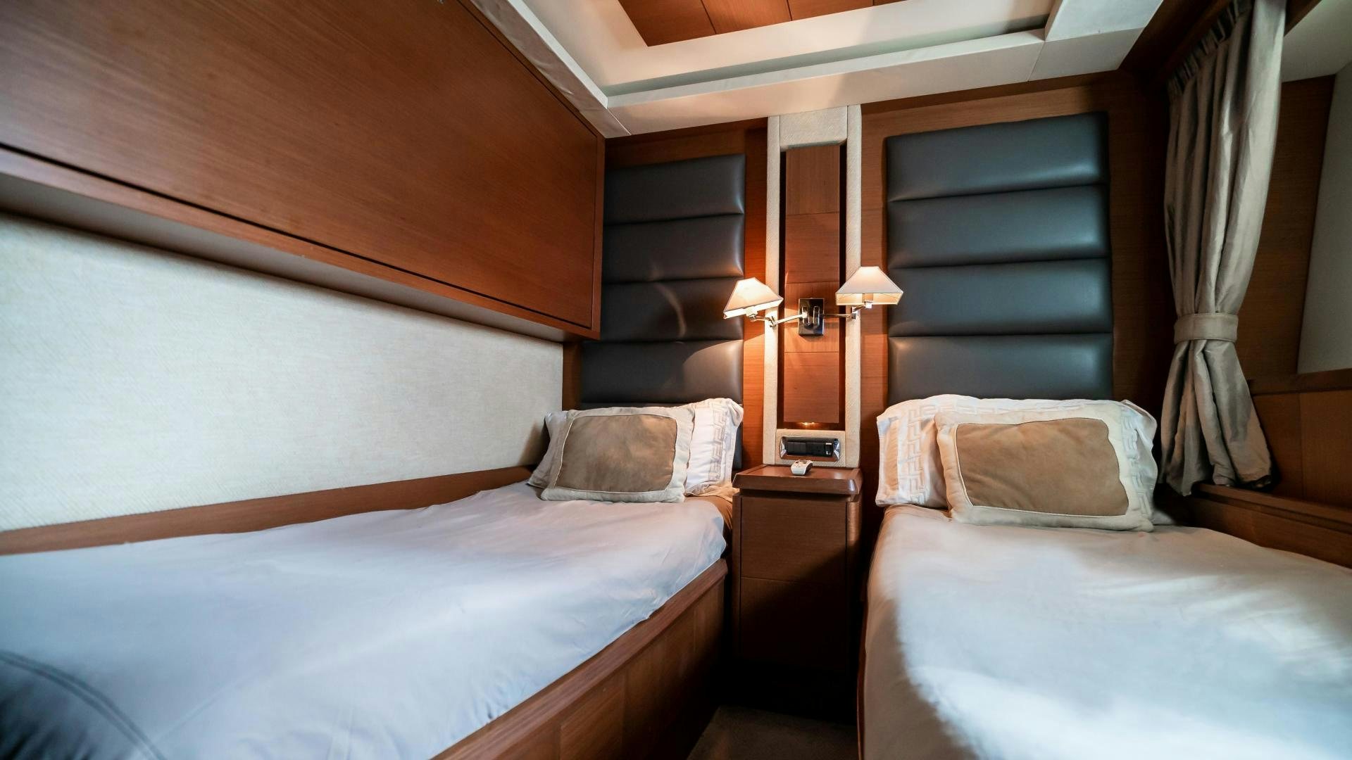 a room with two beds aboard CAMY ED Yacht for Sale