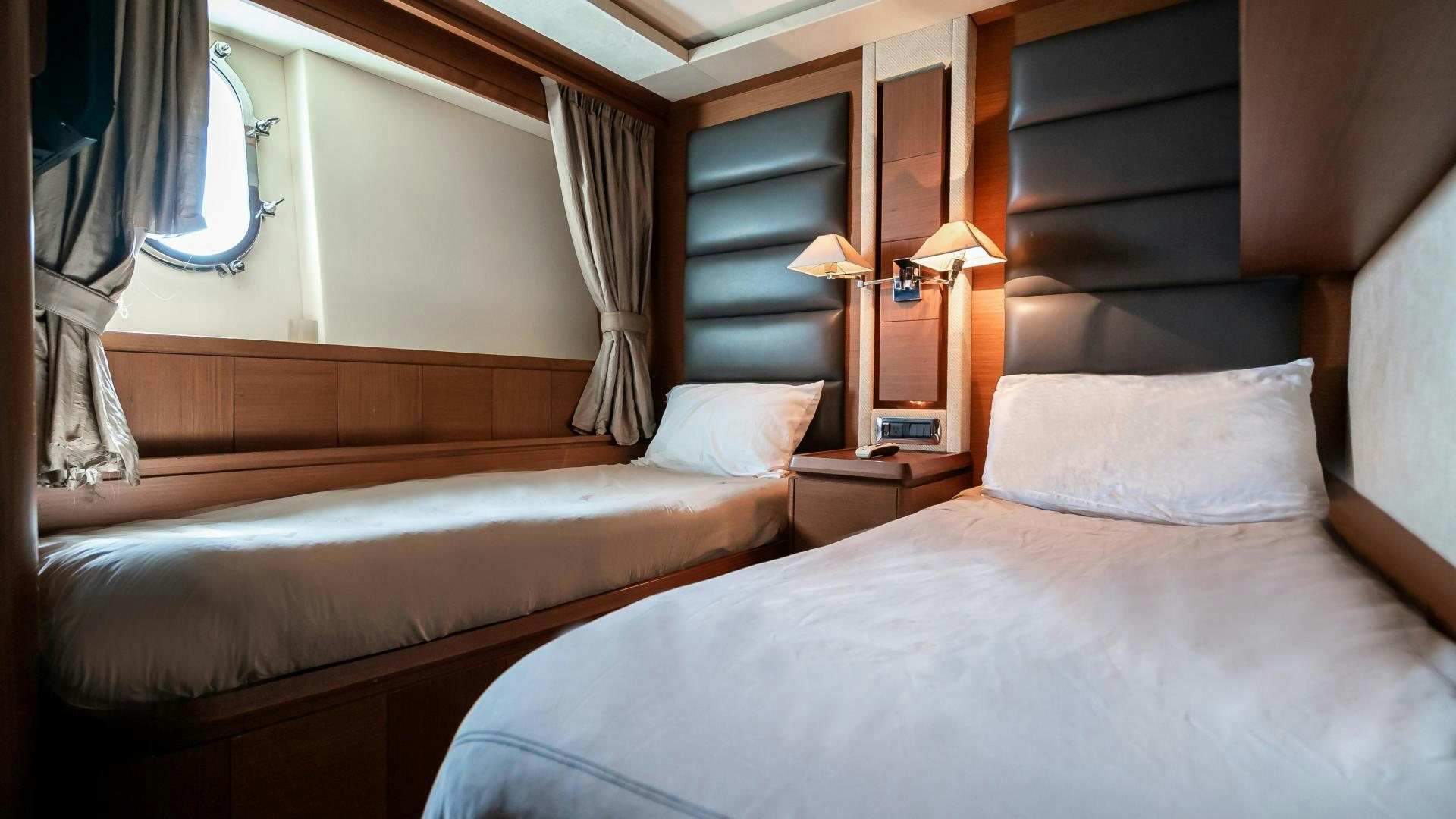 a couple of beds in a hotel room aboard CAMY ED Yacht for Sale