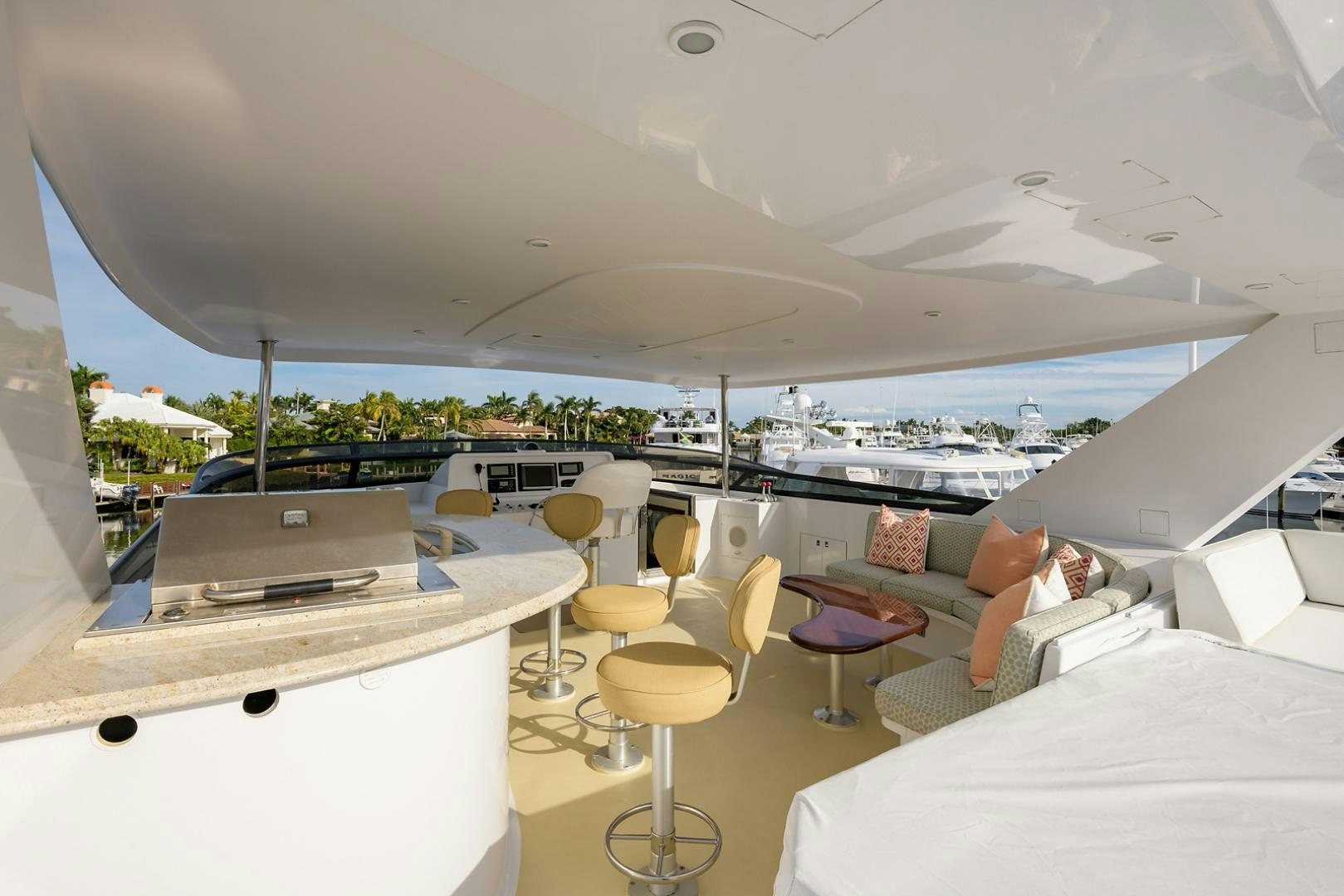 a room with a view of the water and a city aboard MY GIRL Yacht for Sale