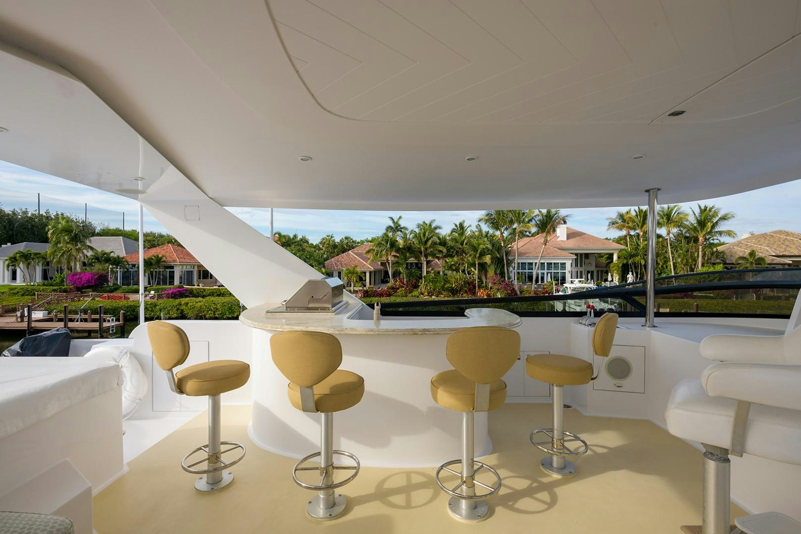 a room with stools and tables aboard MY GIRL Yacht for Sale