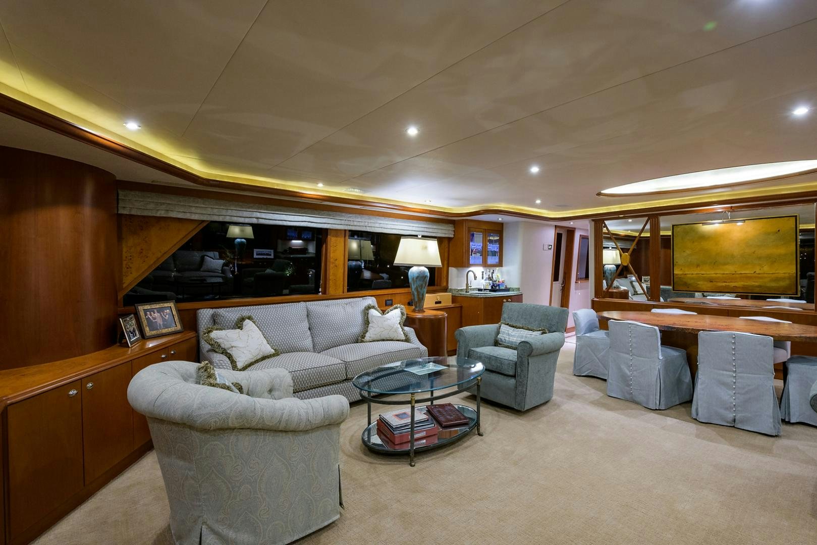 a living room with a couch and a coffee table aboard MY GIRL Yacht for Sale