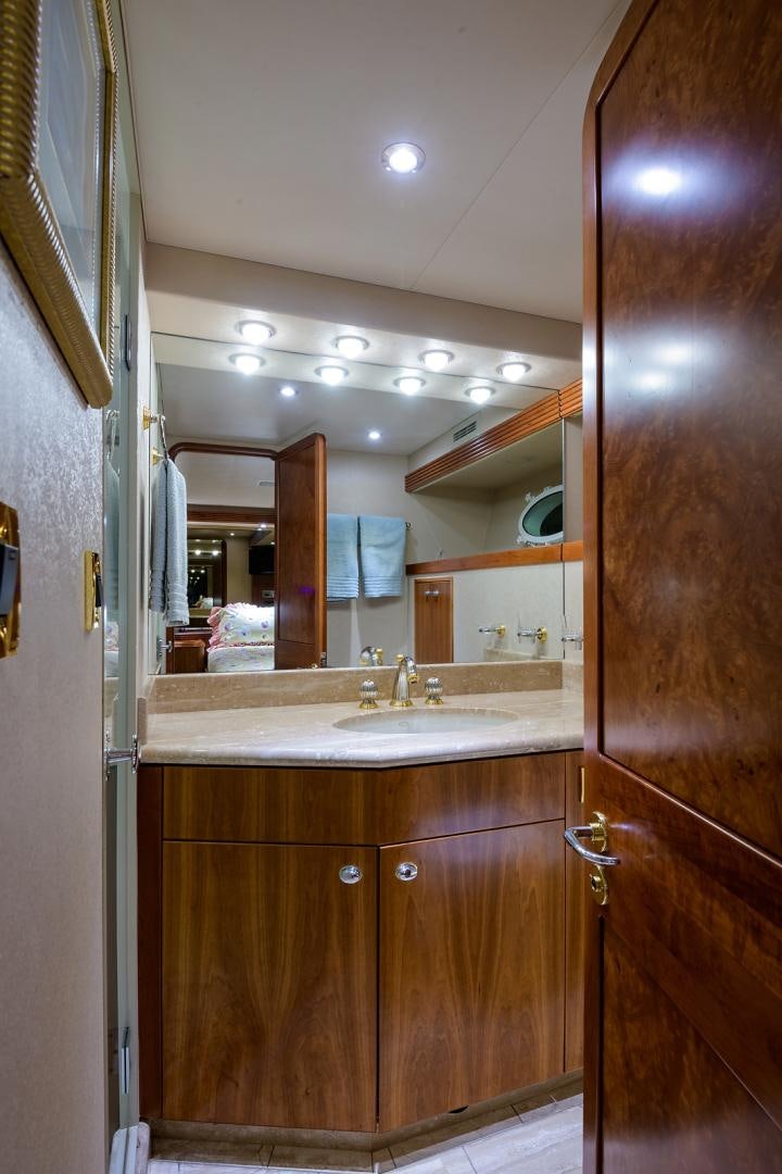 a bathroom with a sink and a mirror aboard MY GIRL Yacht for Sale
