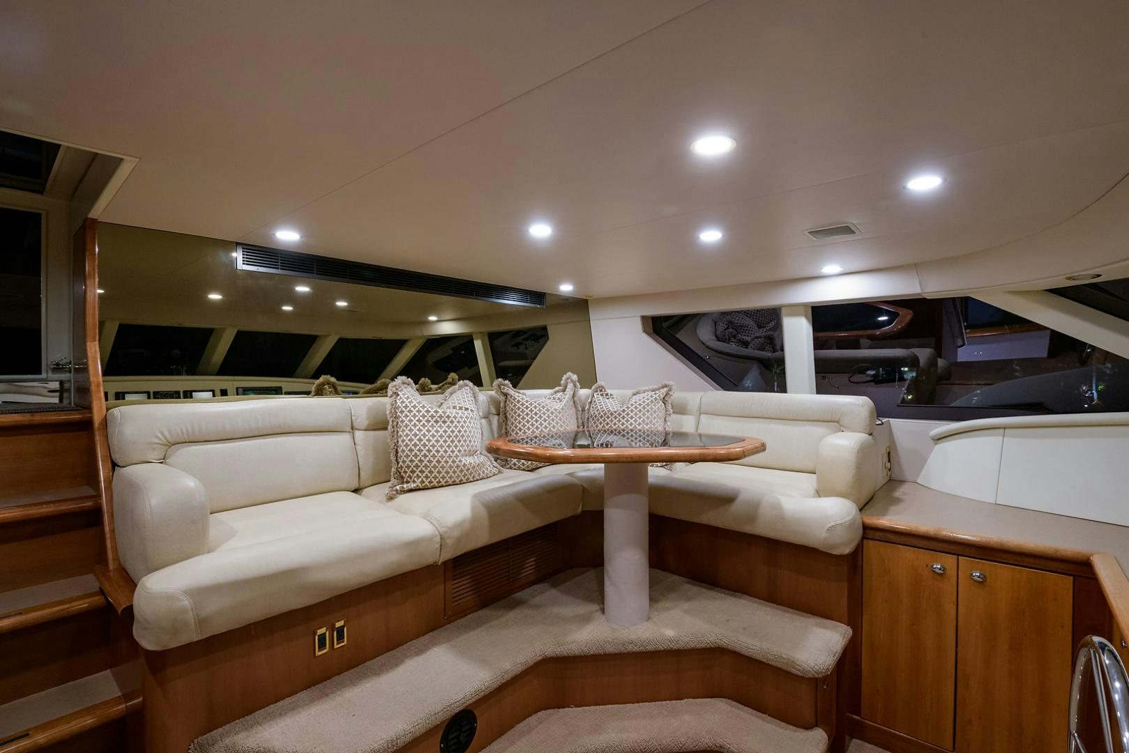 a living room with a couch and a table aboard MY GIRL Yacht for Sale