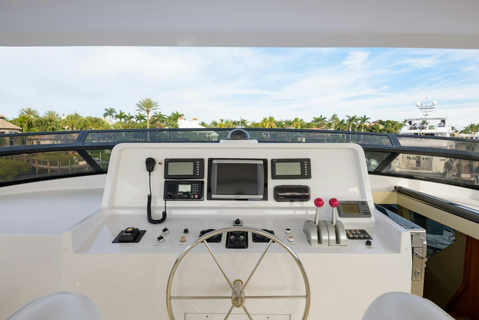 a white boat with a steering wheel aboard MY GIRL Yacht for Sale