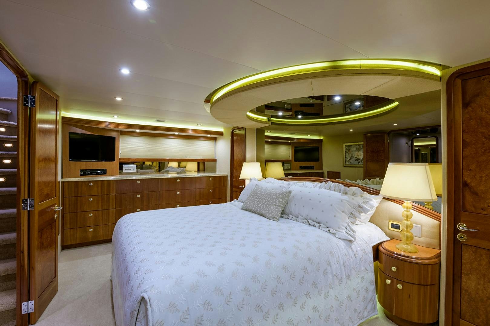 a bedroom with a large bed aboard MY GIRL Yacht for Sale