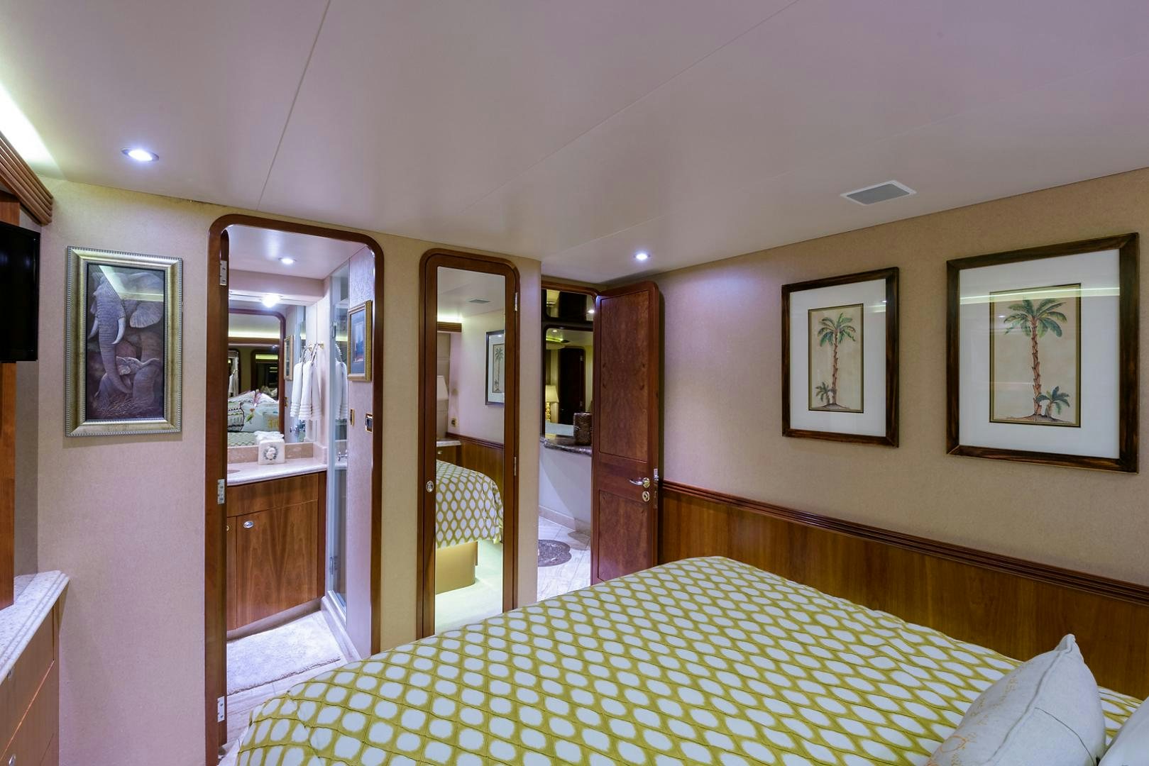a bedroom with a bed and a closet aboard MY GIRL Yacht for Sale