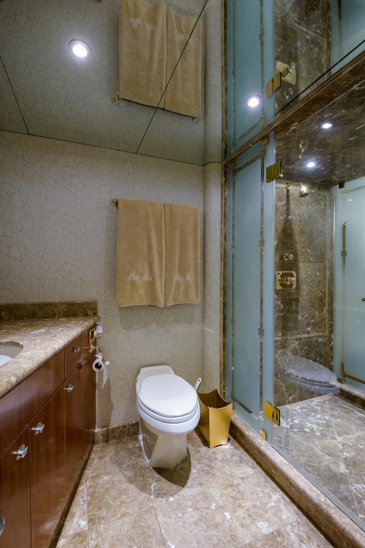 a bathroom with a shower and toilet aboard MY GIRL Yacht for Sale