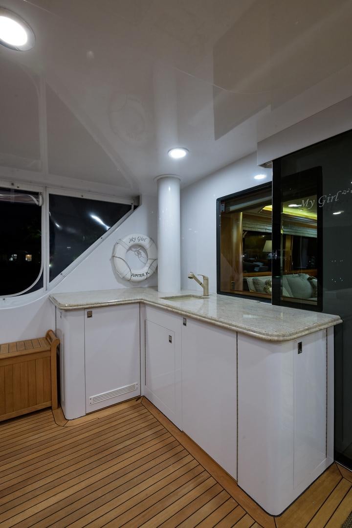a kitchen with white cabinets aboard MY GIRL Yacht for Sale