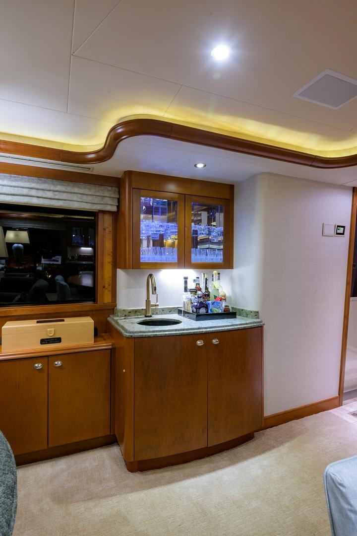 a kitchen with wooden cabinets aboard MY GIRL Yacht for Sale