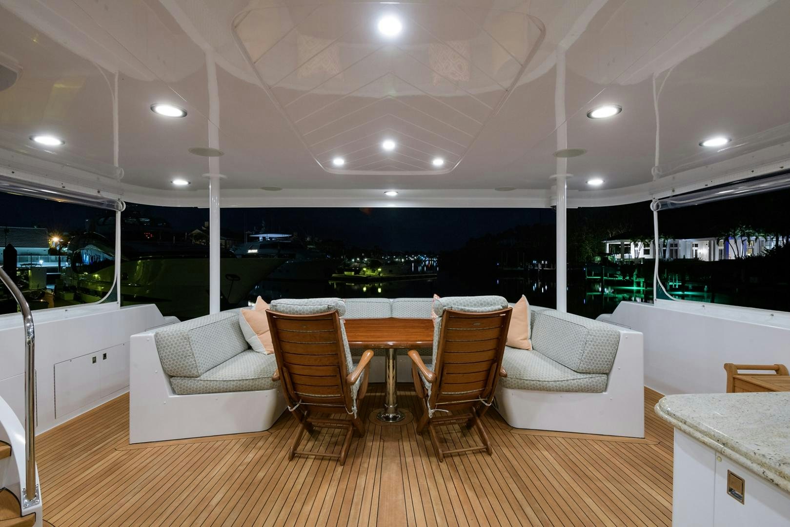 a room with a table chairs and a couch aboard MY GIRL Yacht for Sale