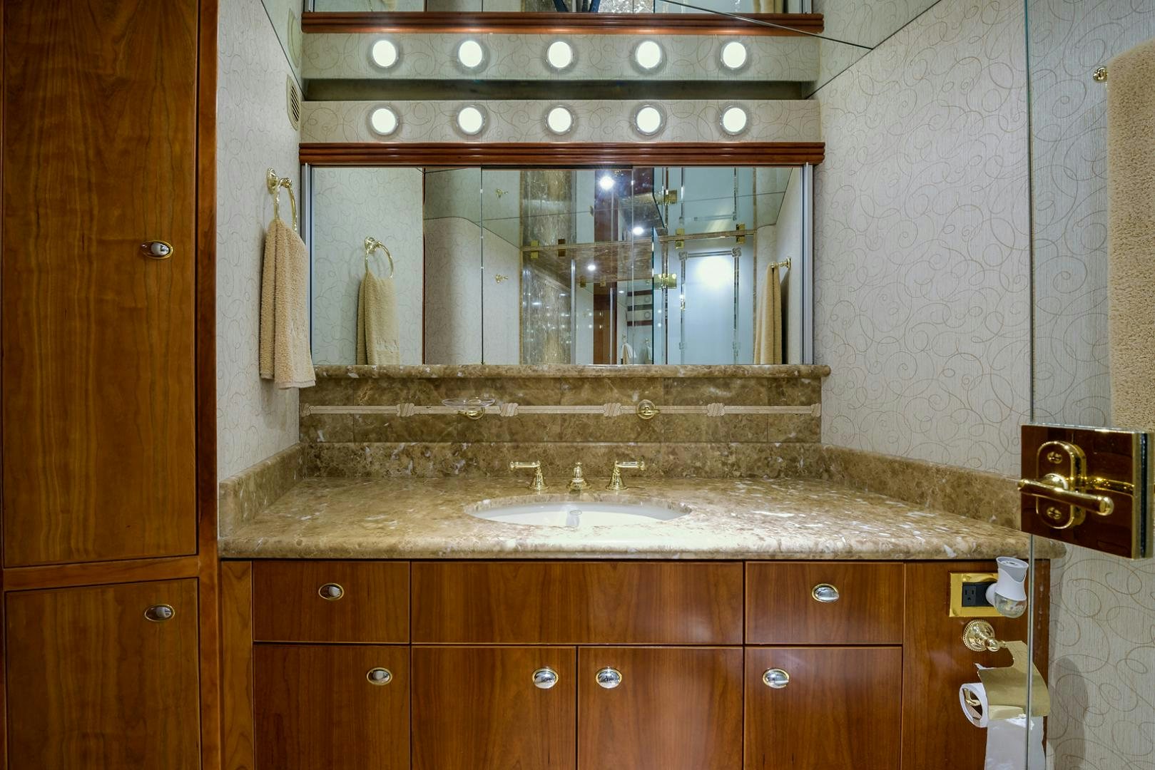 a bathroom with a large mirror aboard MY GIRL Yacht for Sale