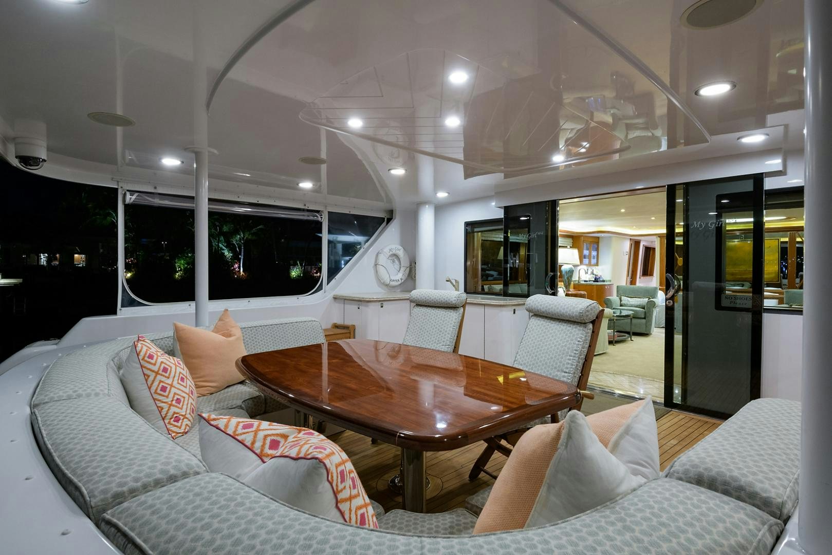 a living room with a table and couches aboard MY GIRL Yacht for Sale