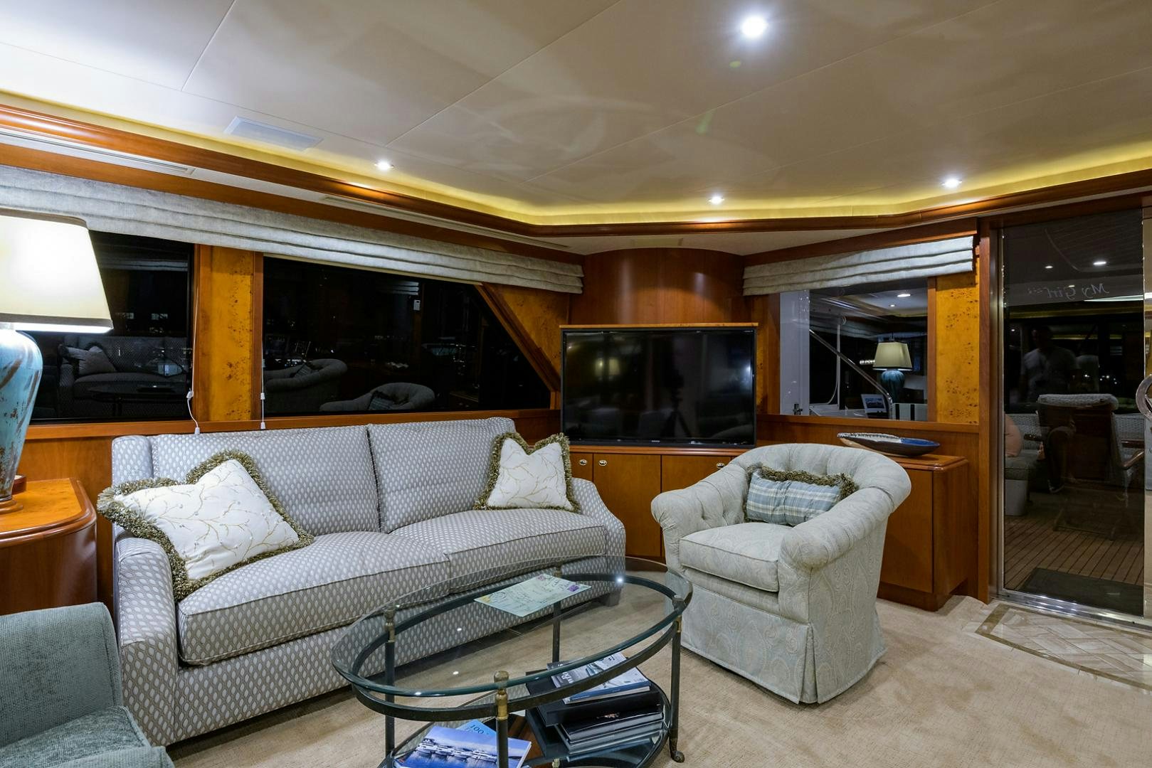 a living room with a couch and a television aboard MY GIRL Yacht for Sale