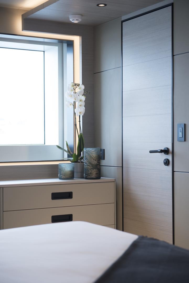 a room with a closet and a bed aboard ALFRESCO 125 Yacht for Sale