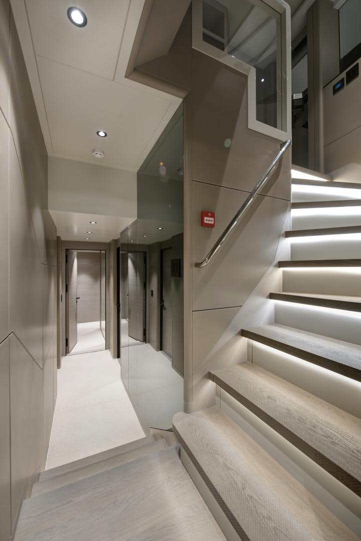a hallway with white walls aboard ALFRESCO 125 Yacht for Sale