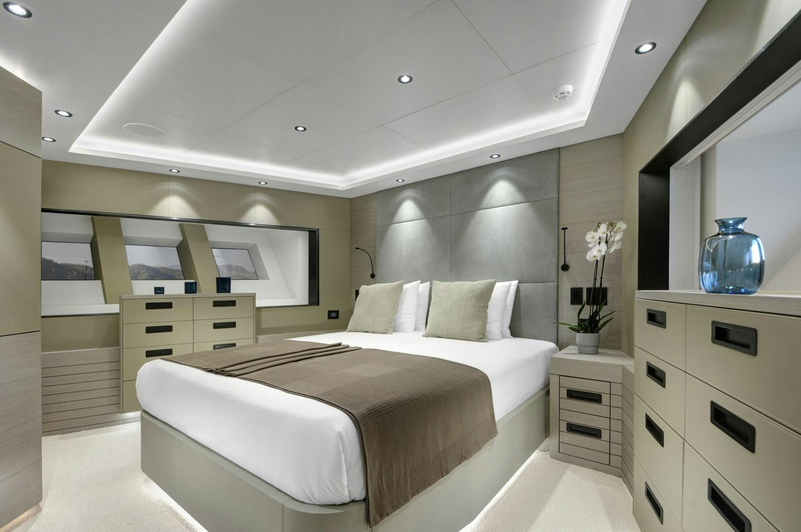 a room with a bed and cabinets aboard ALFRESCO 125 Yacht for Sale