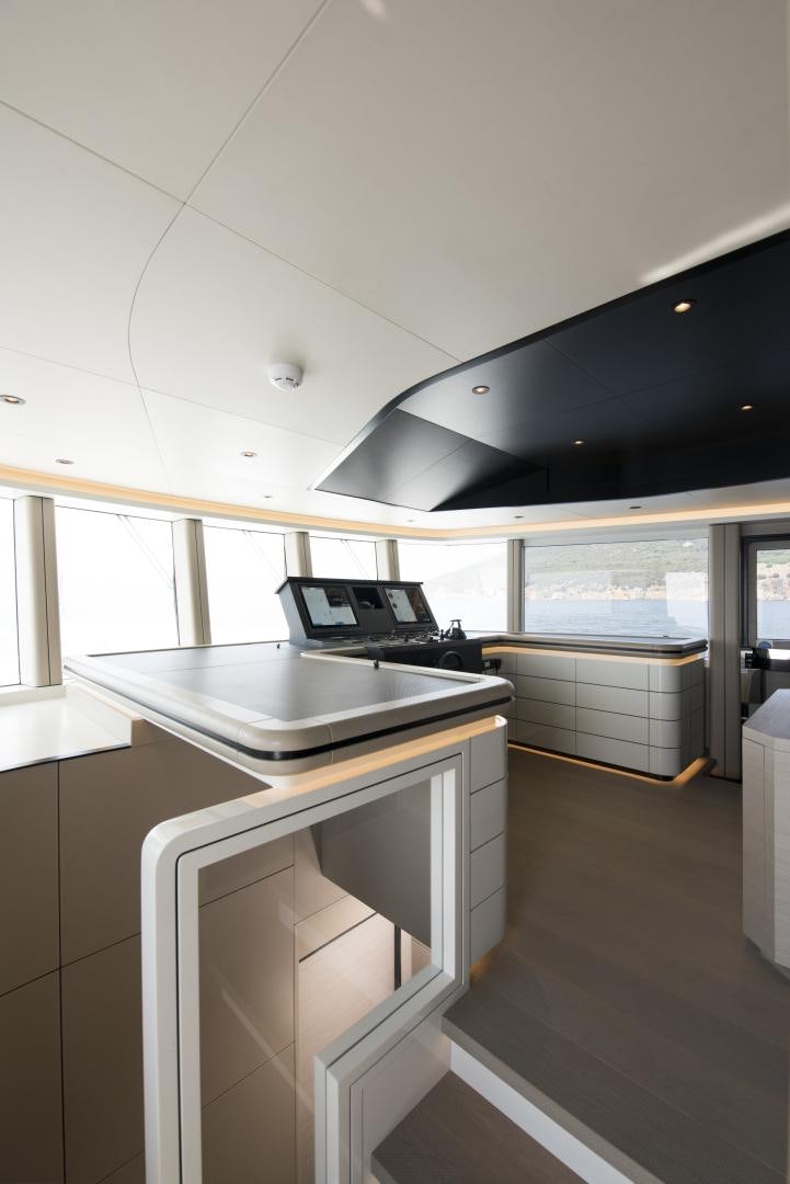a kitchen with a large island aboard ALFRESCO 125 Yacht for Sale