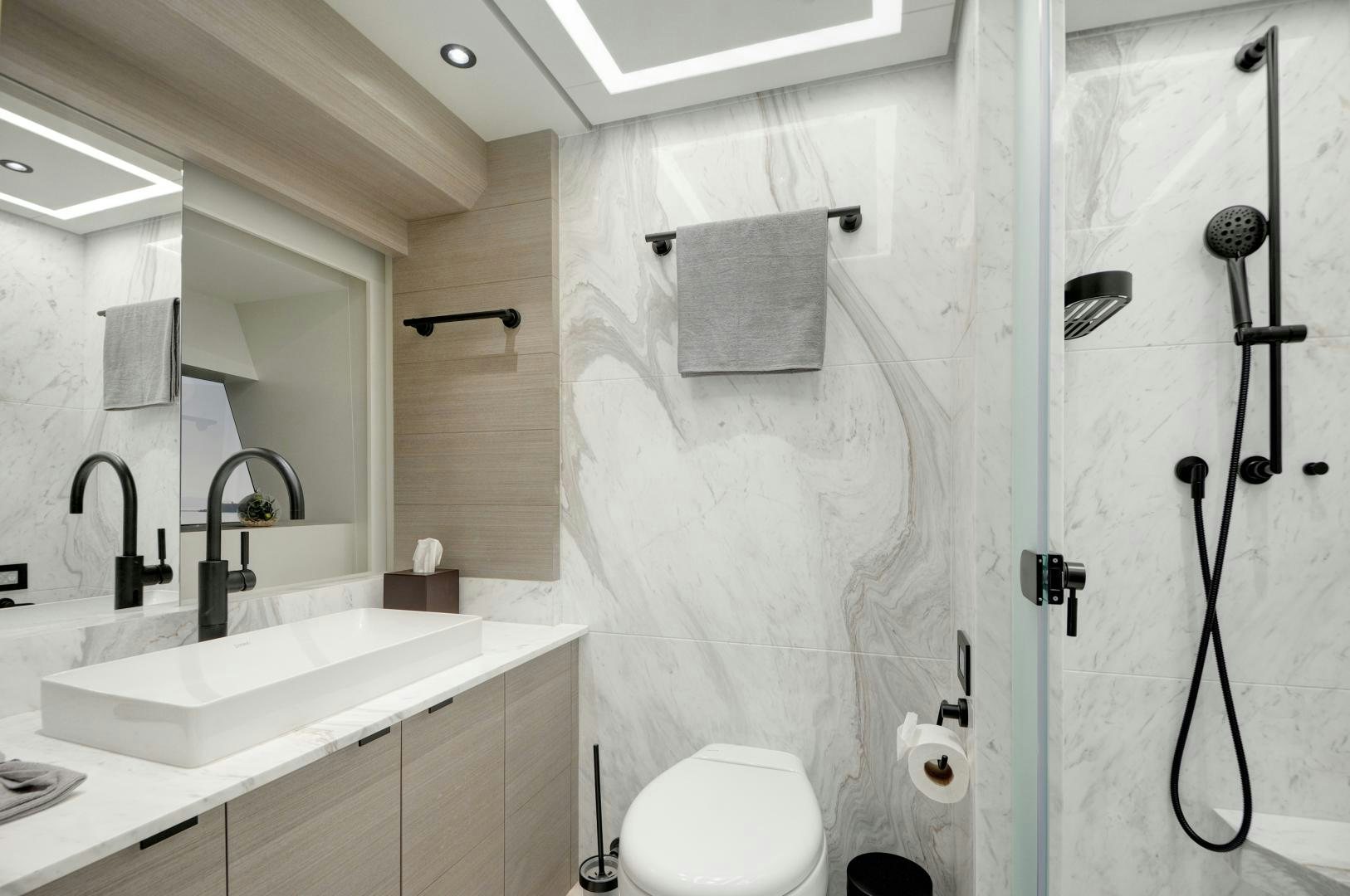 a bathroom with a shower curtain aboard ALFRESCO 125 Yacht for Sale