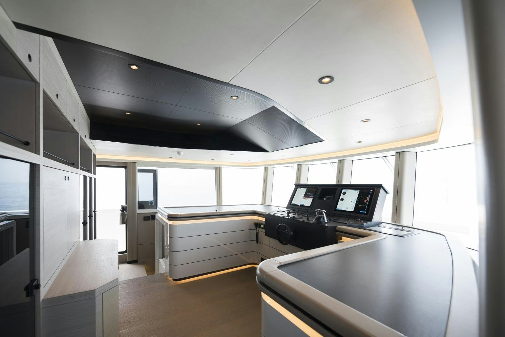 a room with a desk and computer aboard ALFRESCO 125 Yacht for Sale