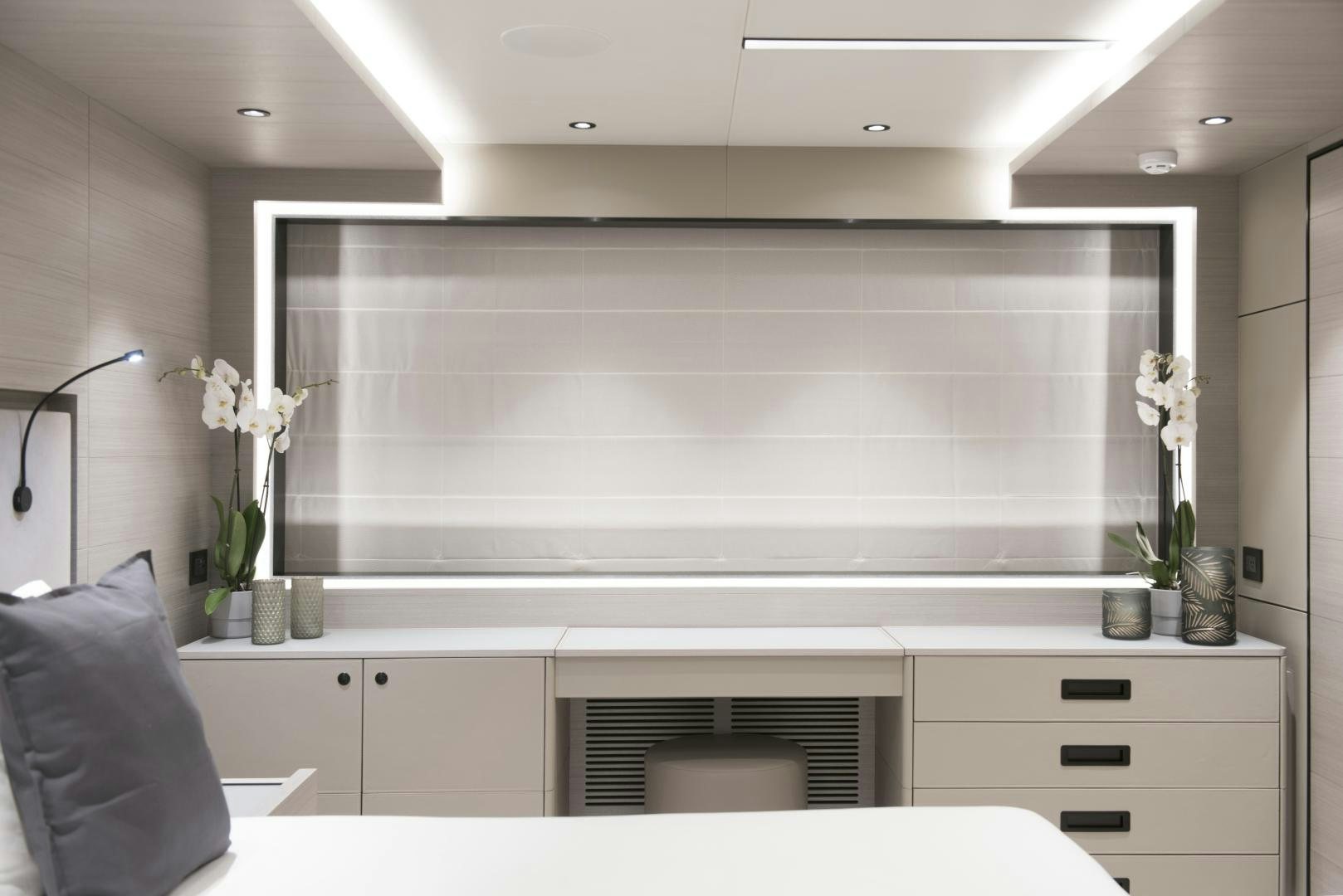 a room with white cabinets and a black pillow aboard ALFRESCO 125 Yacht for Sale