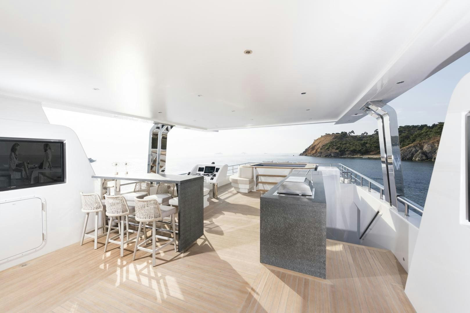 a large white room with a large balcony and a large pool aboard ALFRESCO 125 Yacht for Sale