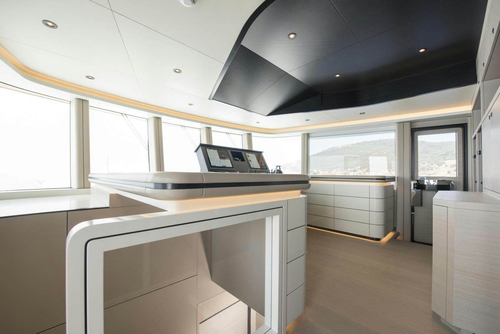 a room with a desk and a laptop on a table aboard ALFRESCO 125 Yacht for Sale