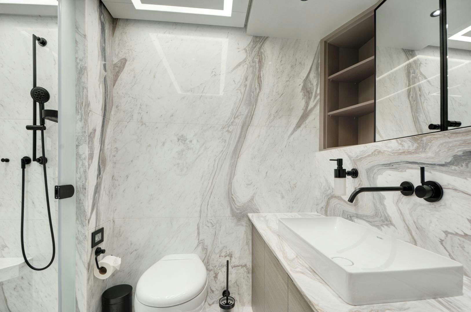 a bathroom with a sink and toilet aboard ALFRESCO 125 Yacht for Sale