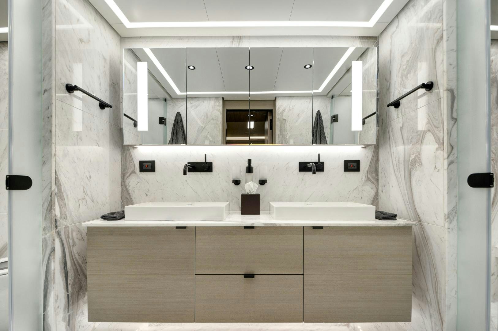 a bathroom with a sink and shower aboard ALFRESCO 125 Yacht for Sale