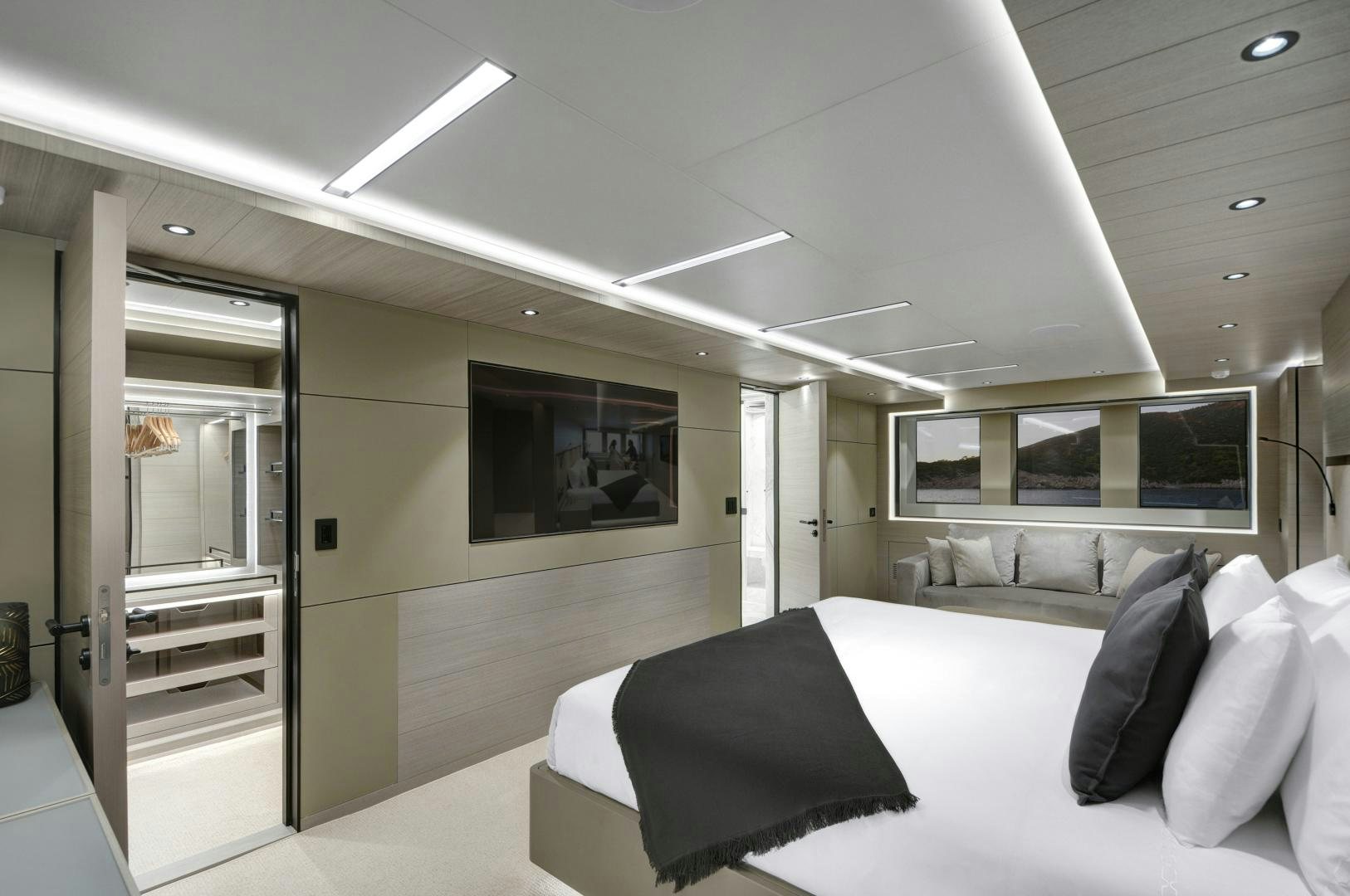 a room with a bed and a tv aboard ALFRESCO 125 Yacht for Sale