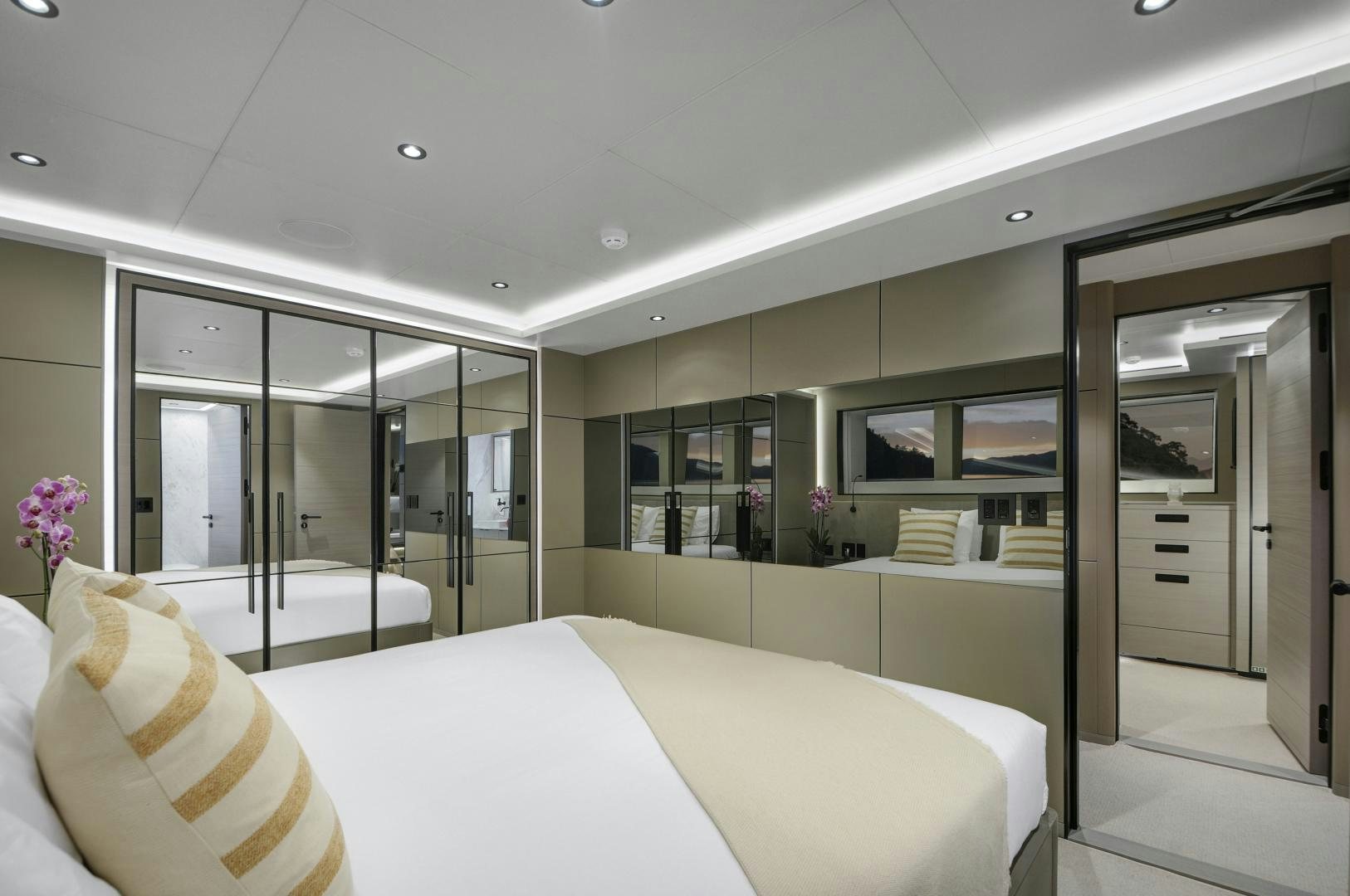 a room with a bed and a large window aboard ALFRESCO 125 Yacht for Sale