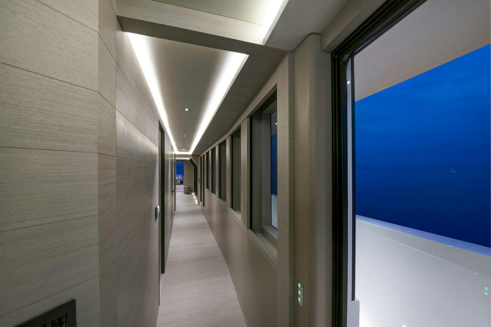 a hallway with a blue door aboard ALFRESCO 125 Yacht for Sale
