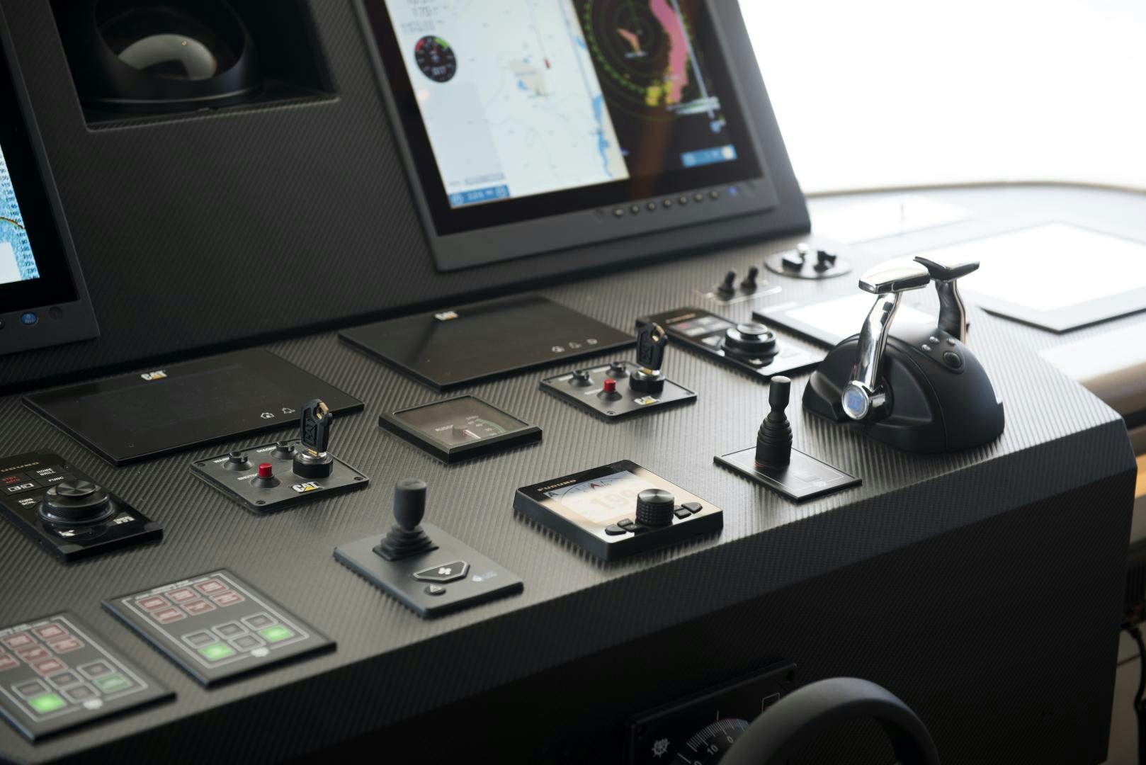 a desk with a computer monitor and phones on it aboard ALFRESCO 125 Yacht for Sale
