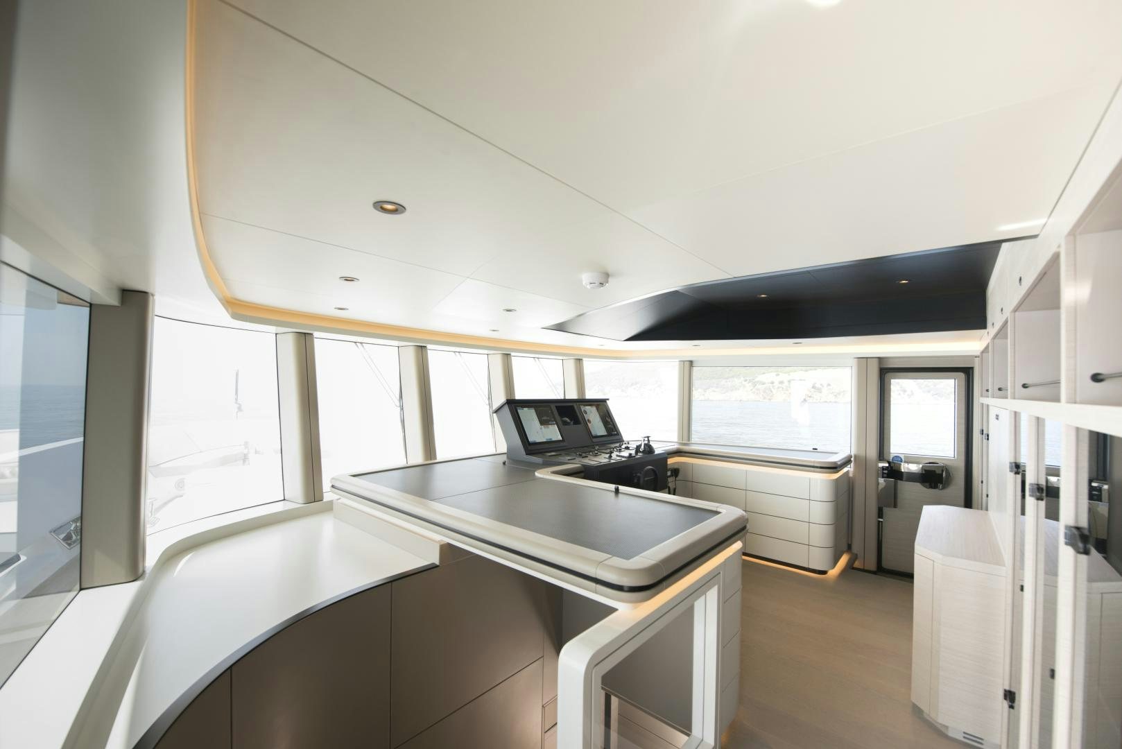 a kitchen with a large island aboard ALFRESCO 125 Yacht for Sale