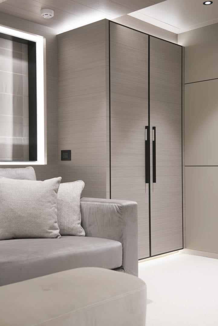 a room with a couch and a door aboard ALFRESCO 125 Yacht for Sale