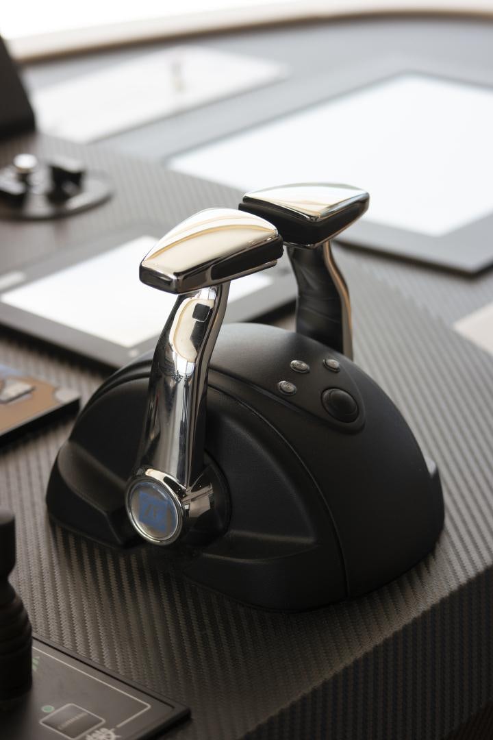 a black headphones on a desk aboard ALFRESCO 125 Yacht for Sale