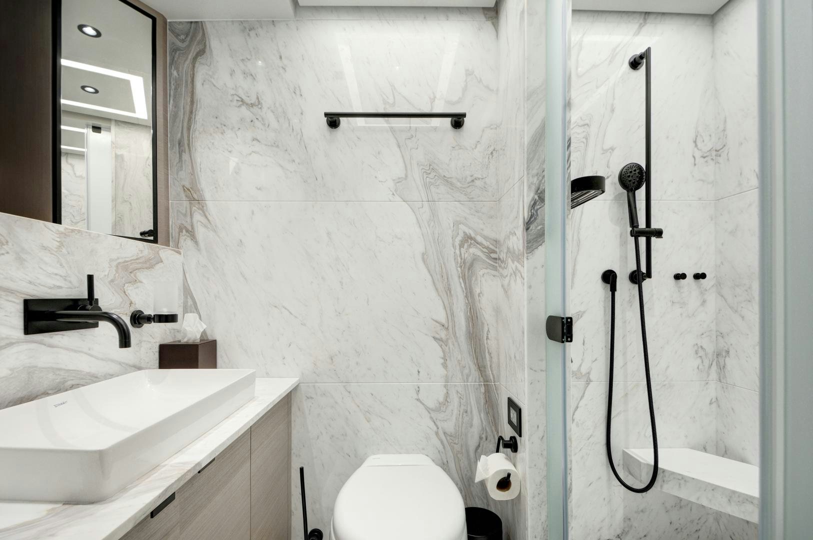 a bathroom with a sink and a toilet aboard ALFRESCO 125 Yacht for Sale