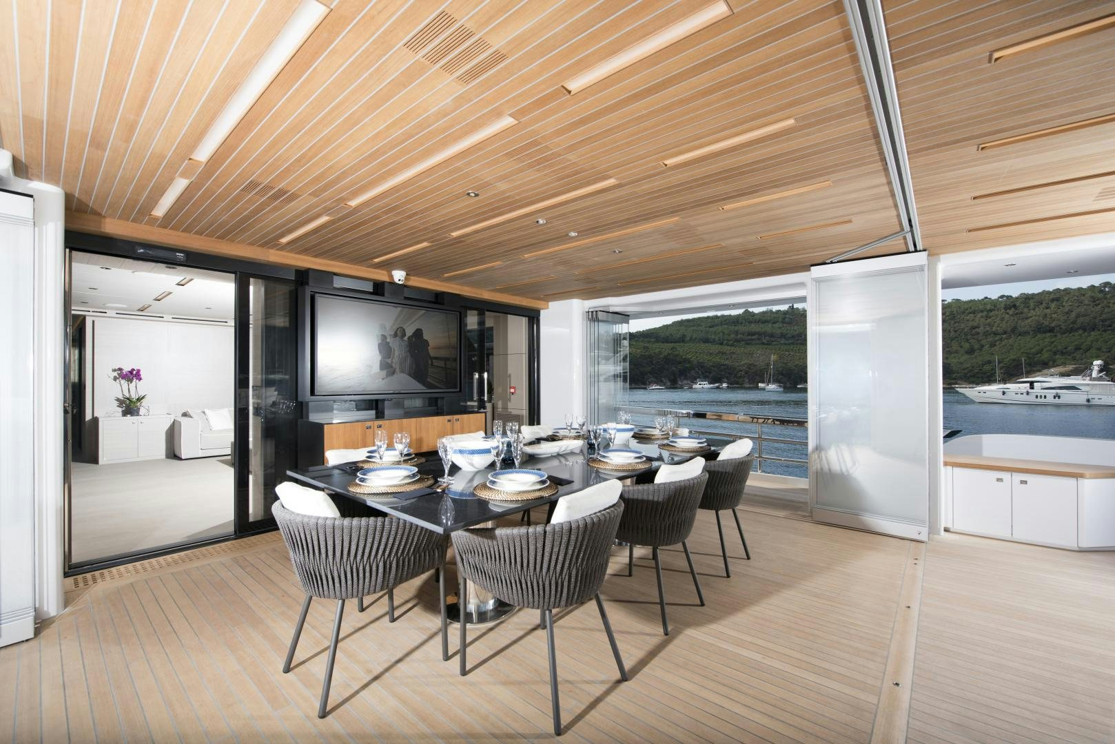 a large open kitchen and dining area aboard ALFRESCO 125 Yacht for Sale