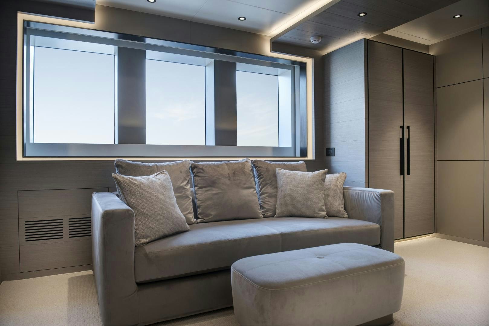 a couch in a room aboard ALFRESCO 125 Yacht for Sale