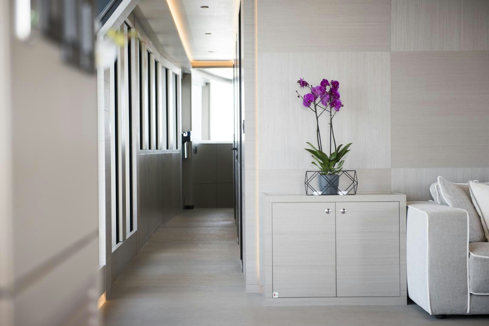 a vase of flowers on a table aboard ALFRESCO 125 Yacht for Sale