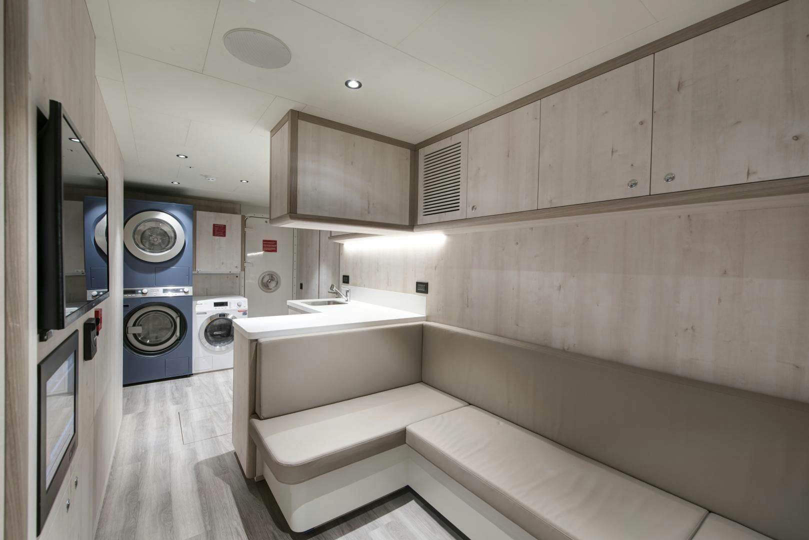 a room with a washing machine and sink aboard ALFRESCO 125 Yacht for Sale
