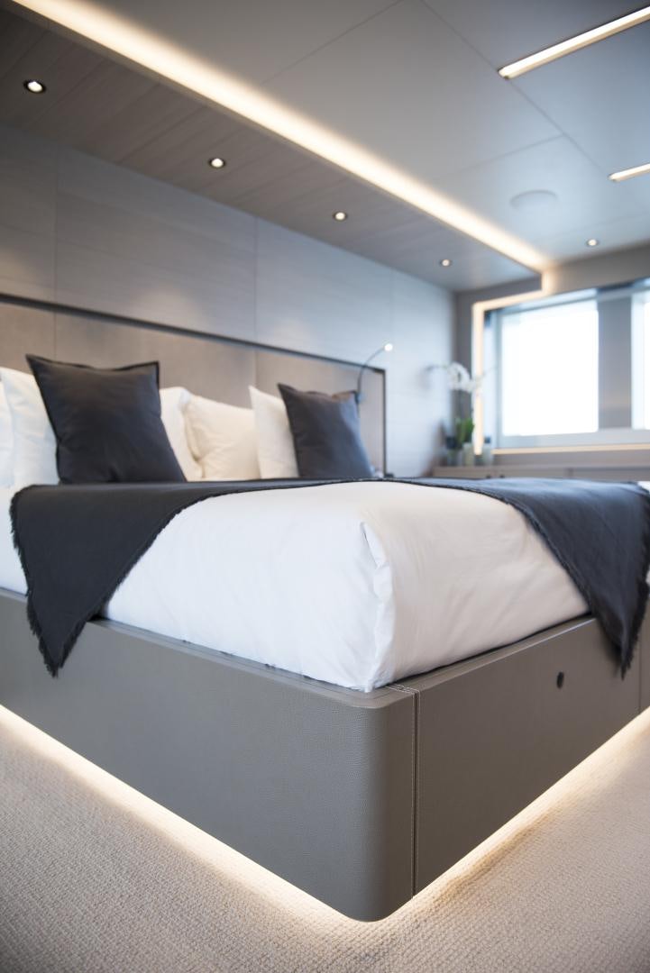 a bed with white sheets aboard ALFRESCO 125 Yacht for Sale