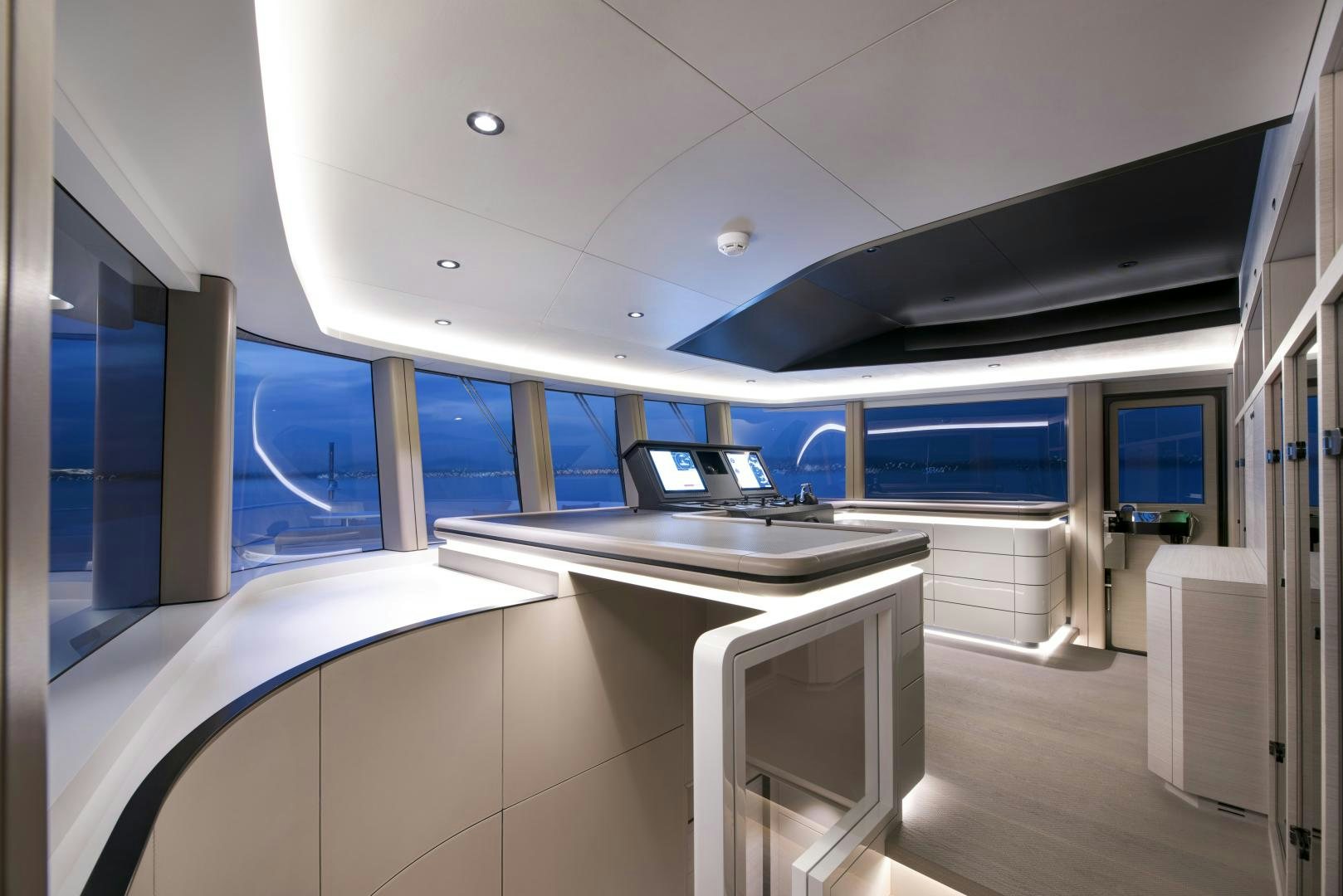 a room with a desk and a laptop on a table aboard ALFRESCO 125 Yacht for Sale