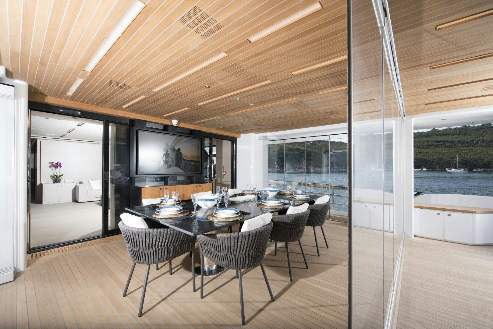 a large room with tables and chairs aboard ALFRESCO 125 Yacht for Sale