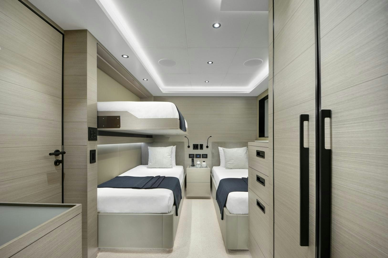 a room with a bed and a closet aboard ALFRESCO 125 Yacht for Sale