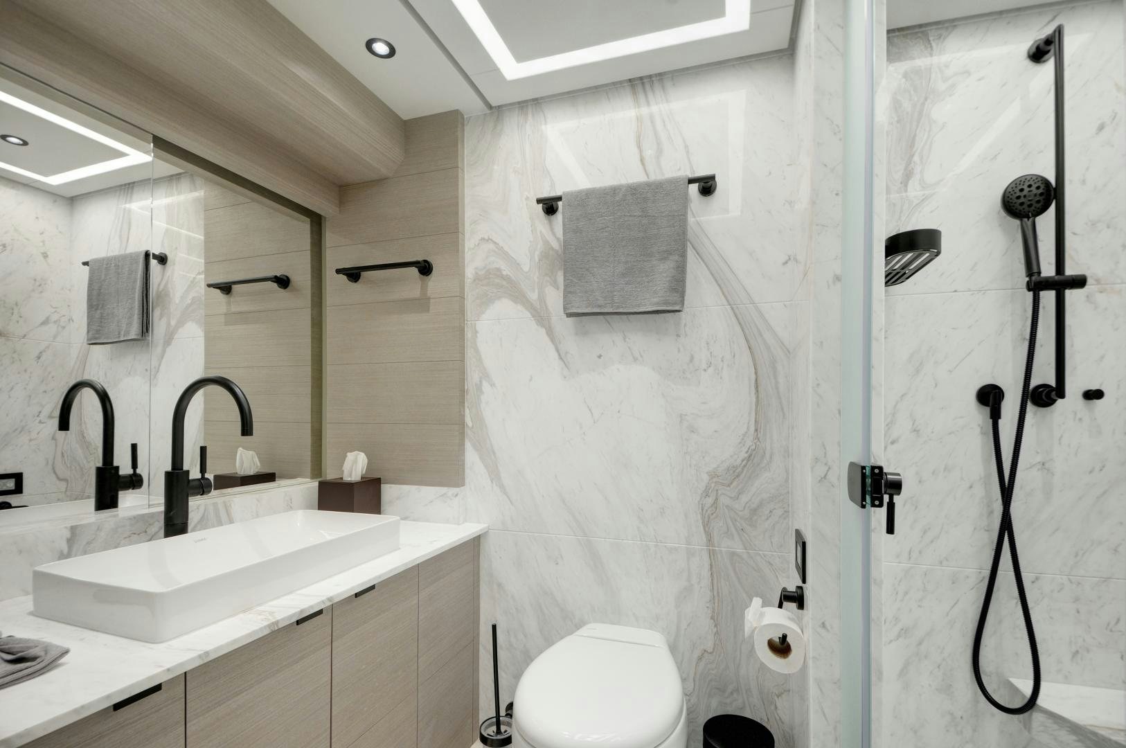 a bathroom with a shower curtain aboard ALFRESCO 125 Yacht for Sale