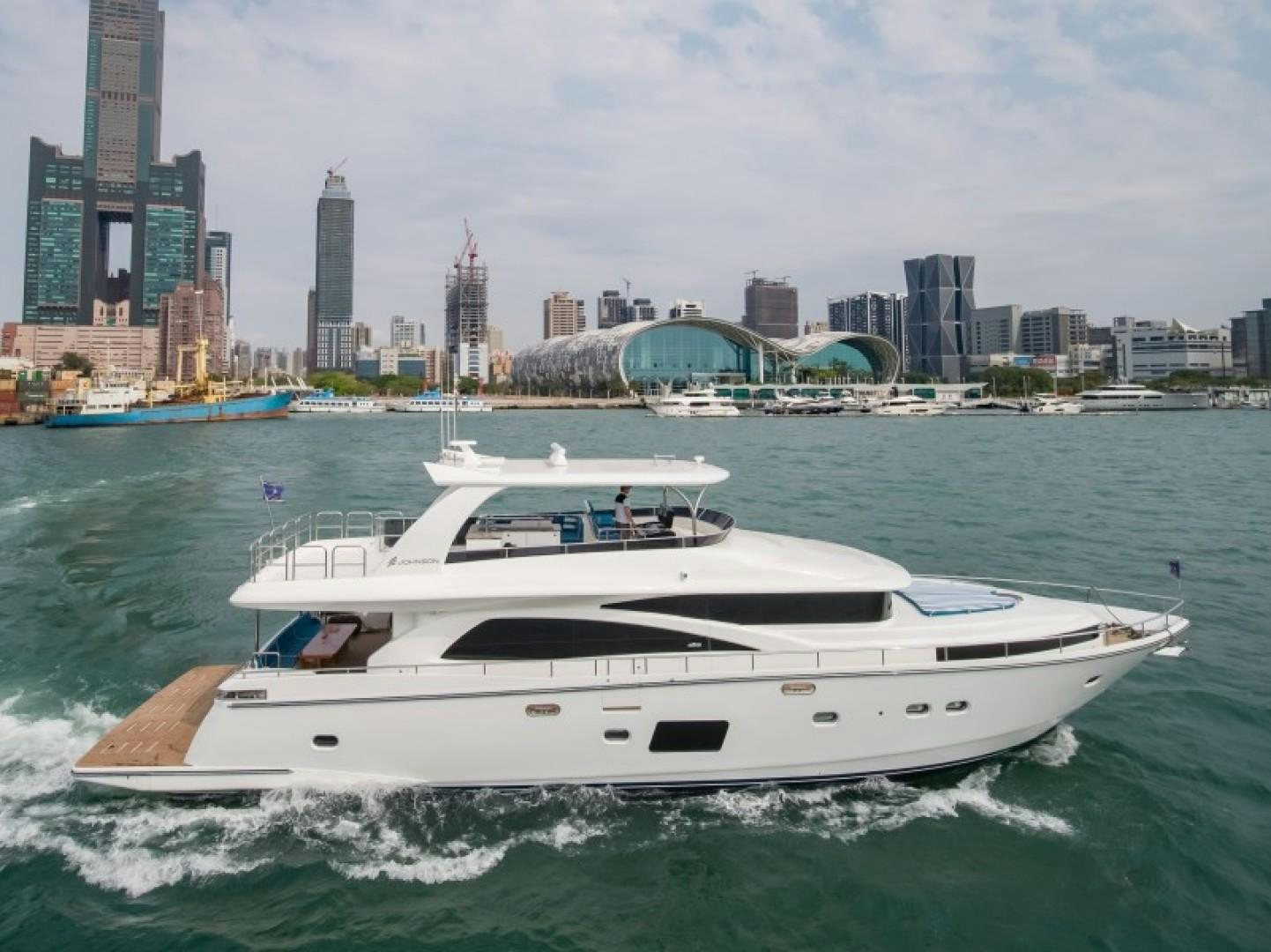 a boat on the water aboard JOHNSON 80' FLYBRIDGE W/FISHING COCKPIT Yacht for Sale