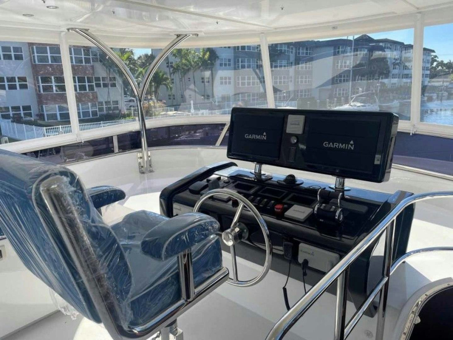 inside of a car aboard JOHNSON 80' FLYBRIDGE W/FISHING COCKPIT Yacht for Sale
