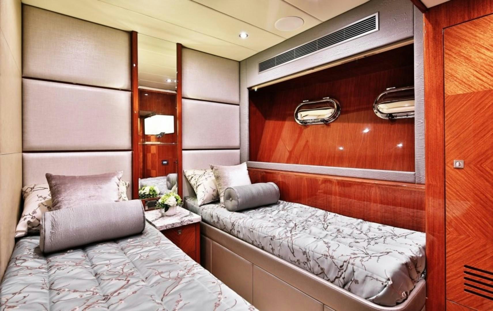 a room with two beds aboard JOHNSON 80' FLYBRIDGE W/FISHING COCKPIT Yacht for Sale