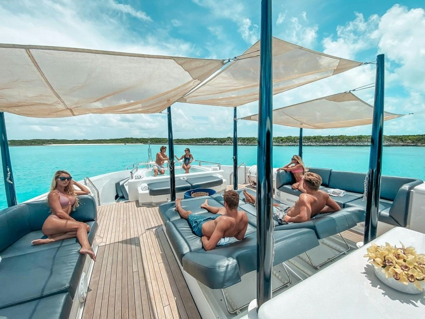 people sitting on a boat aboard OCULUS Yacht for Sale