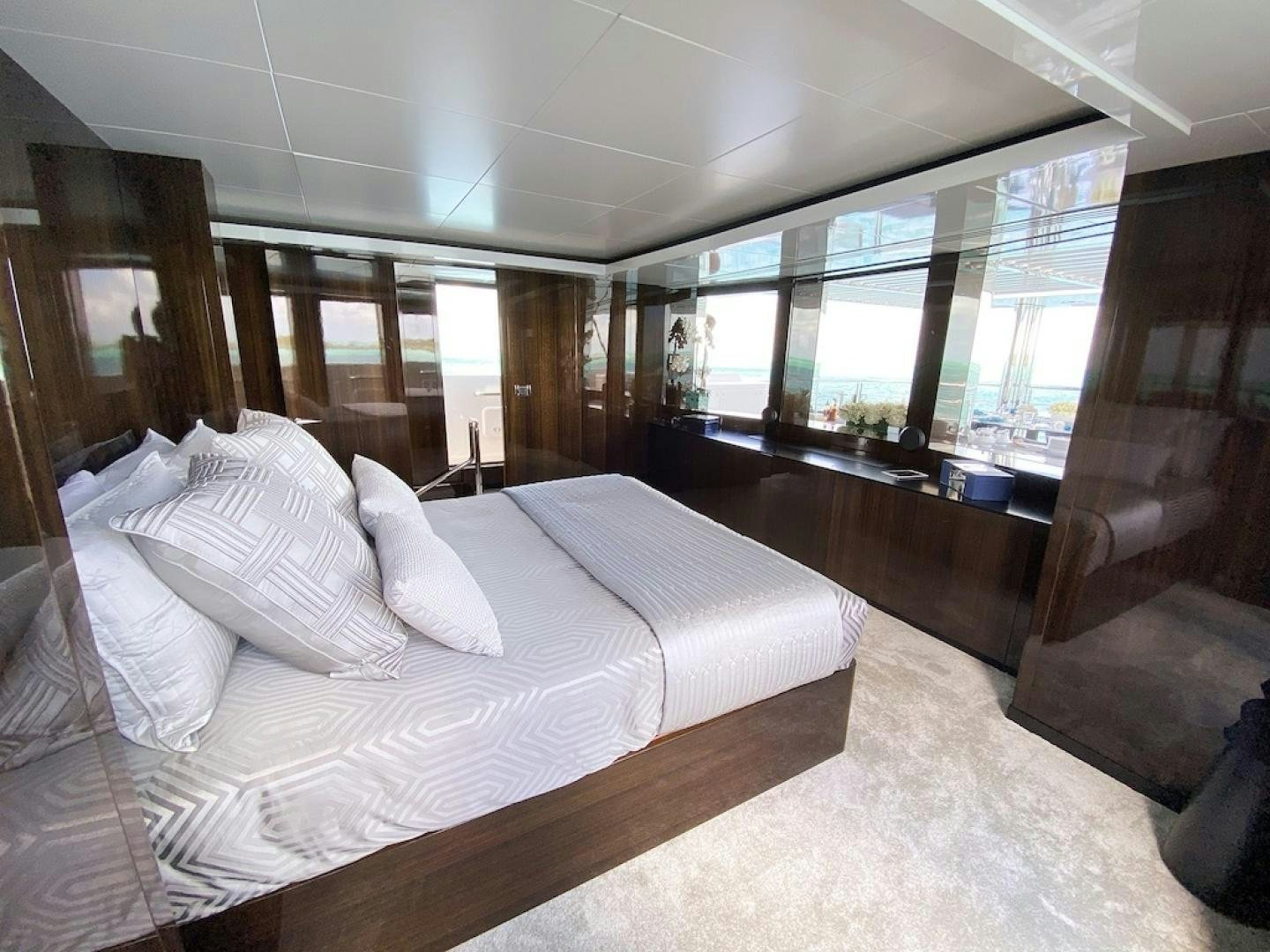 a bed in a room aboard OCULUS Yacht for Sale